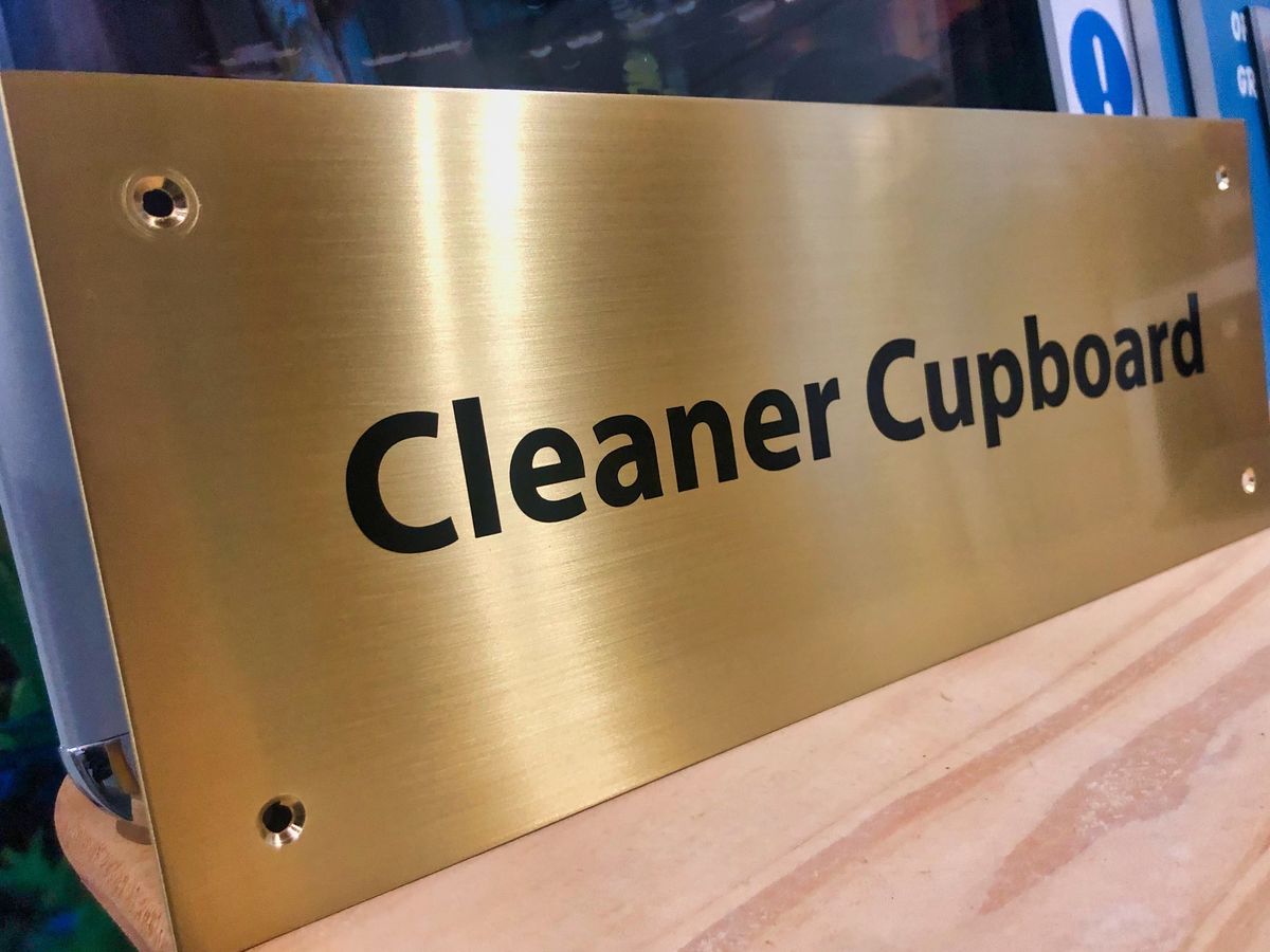 interior polished brass door sign
